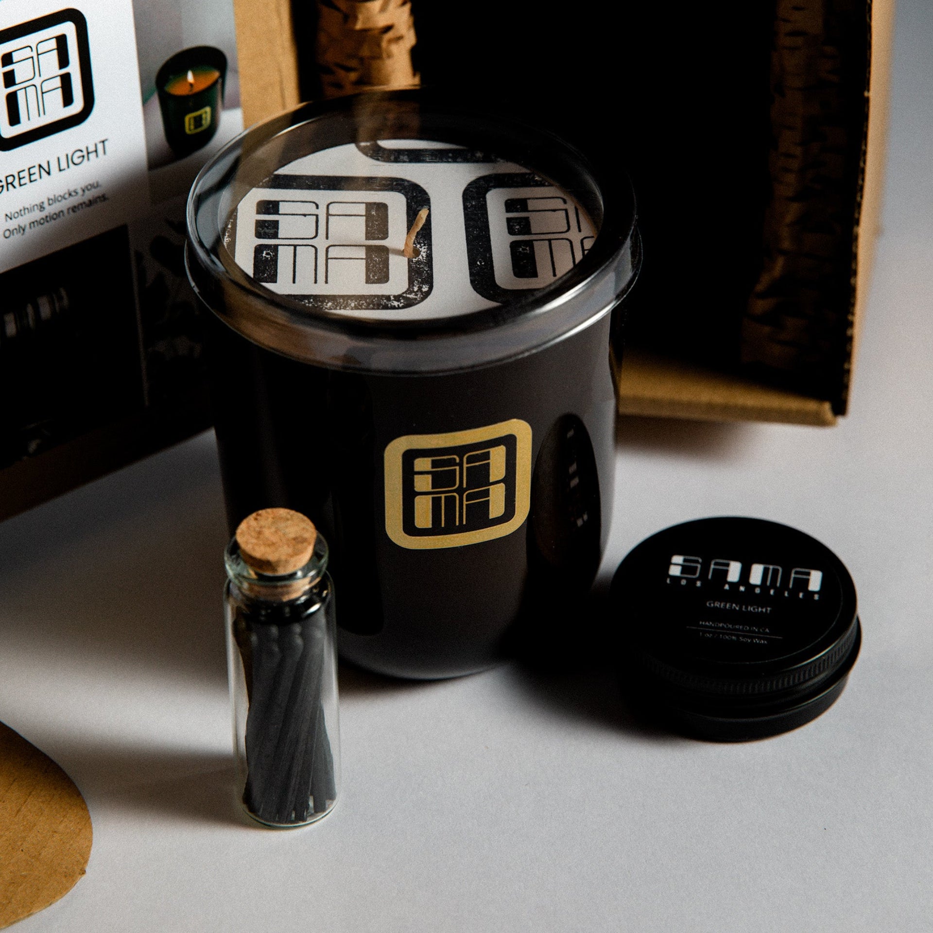 Candle with decorative elements on a gray surface